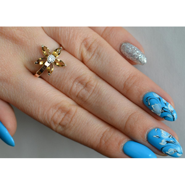 Серебряное кольцо с золотыми вставками (034к)