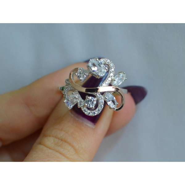 Серебряное кольцо с золотыми вставками (151к)