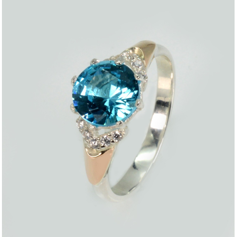 Срібна каблучка з золотими вставками