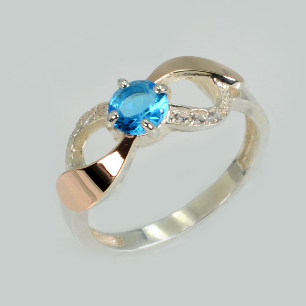 Серебряное кольцо с золотыми вставками (236к)