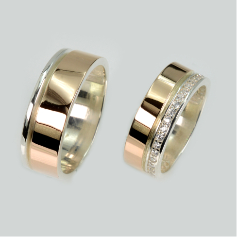 Пара обручальных колец из серебра с золотом