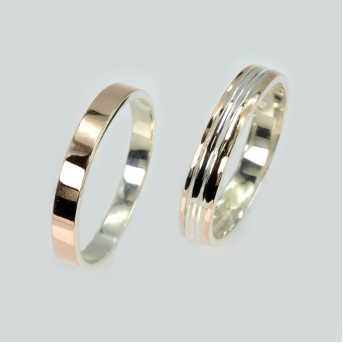 Пара обручальных колец из серебра с золотом