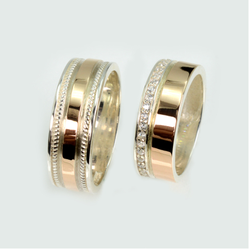 Пара обручальных колец из серебра с золотом