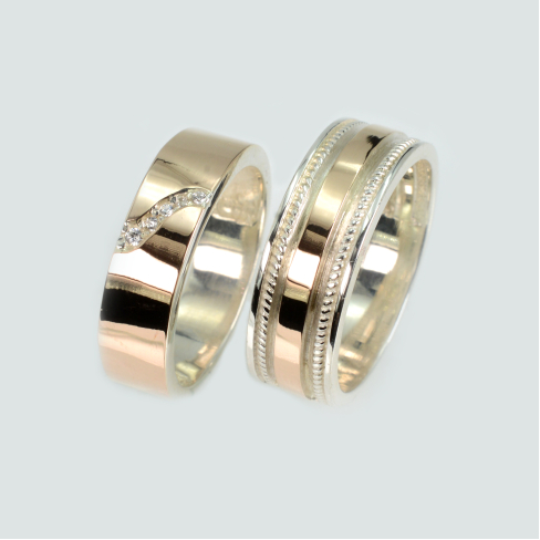 Пара обручальных колец из серебра с золотом