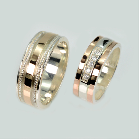 Пара обручальных колец из серебра с золотом
