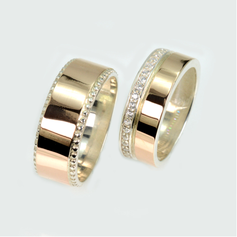 Пара обручальных колец из серебра с золотом