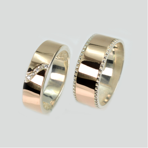 Пара обручальных колец из серебра с золотом