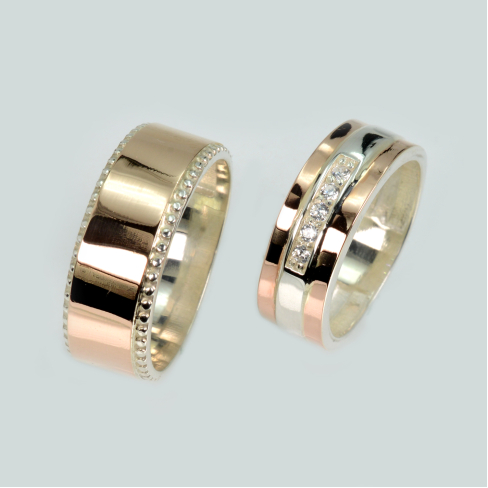 Пара обручальных колец из серебра с золотом