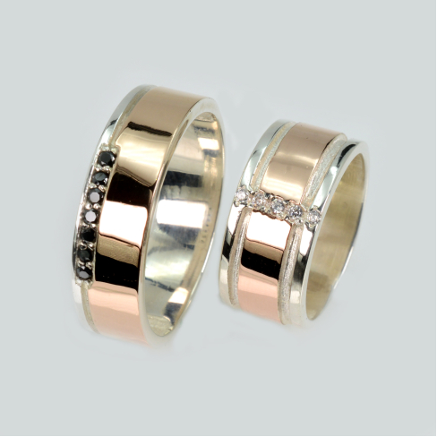 Пара обручальных колец из серебра с золотом
