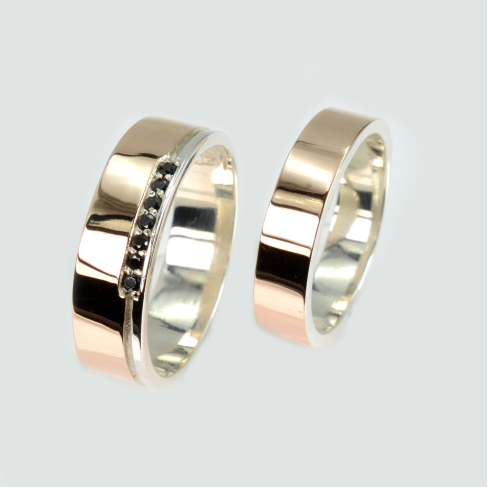 Пара обручальных колец из серебра с золотом