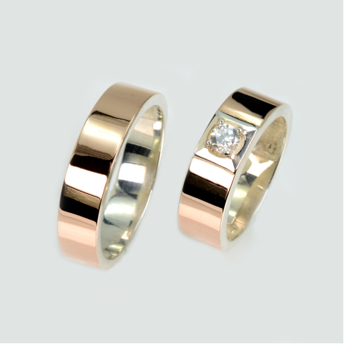 Пара обручальных колец из серебра с золотом