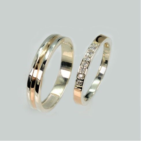 Пара обручальных колец из серебра с золотом