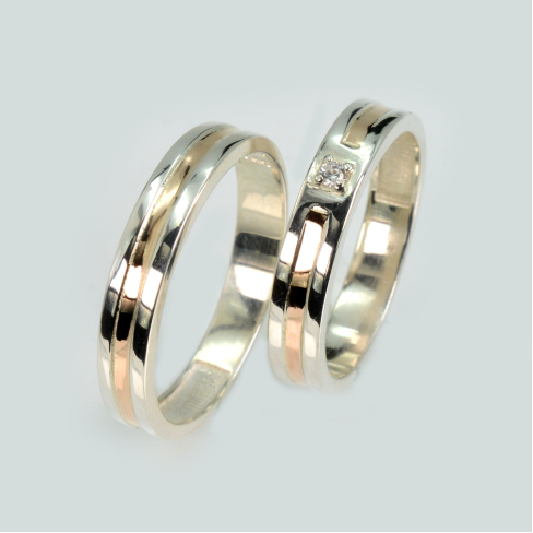 Пара обручальных колец из серебра с золотом