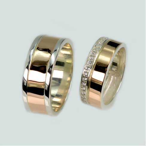 Пара срібних обручок з золотом