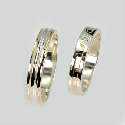 Пара обручальных колец из серебра с золотом