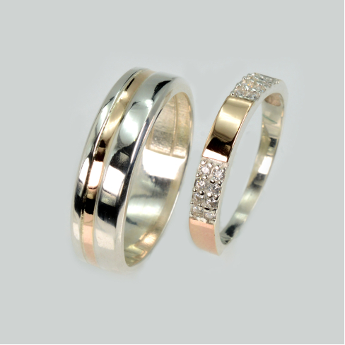 Пара обручальных колец из серебра с золотом