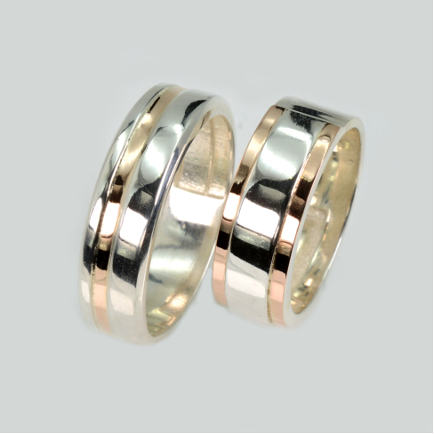 Пара срібних обручок з золотом