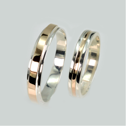 Пара обручальных колец из серебра с золотом