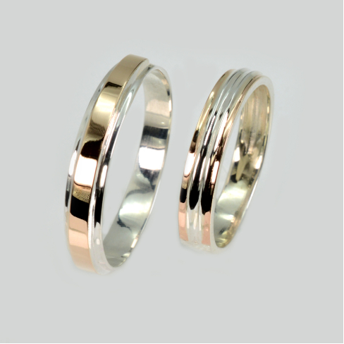 Пара обручальных колец из серебра с золотом