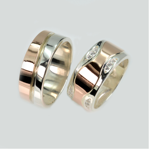 Пара обручальных колец из серебра с золотом